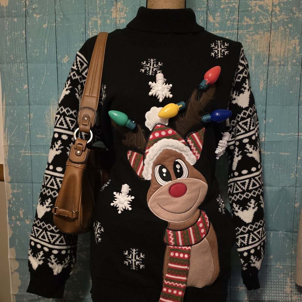 Black and white Christmas reindeer sweater with lights and‎ pockets.